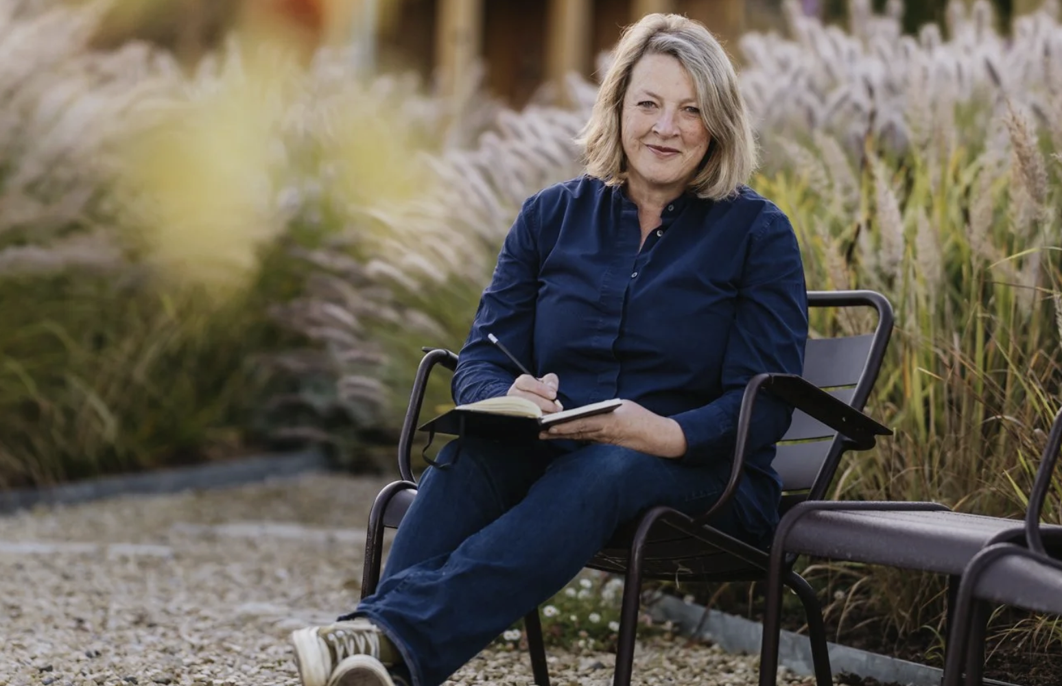 A person sitting on a chairDescription automatically generated