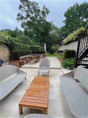 A small terraced garden over a roof in central London
