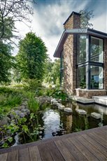Woodland garden:  A straight boardwalk extends from the back patio of the house to the garden, passing through a pool designed to a natural shape with stepping stones across.