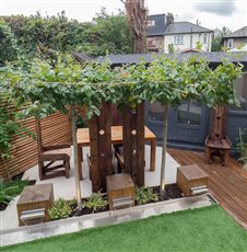 Directly adjoining the house will be a patio laid with porcelain plank tiles installed in a stretcher pattern on a diagonal to the garden. The centre of the garden will feature a rectangular artificial lawn, installed with the same orientation.