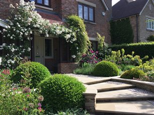 Surrey Arts and Crafts inspired front garden making space for people ( and cars)