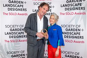 SGLD Awards 2026 Lifetime Achievement Award winner Tom Stuart-Smith OBE FSGLD with gold sponsor Alitex