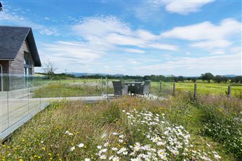 A wonderful place to sit, nestled in planting and immersed in the panoramic views of the Scottish landscape.