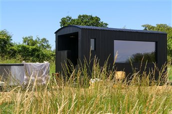 MAA - luxury outdoor sauna for 8-10 people with integrated porch and shower.