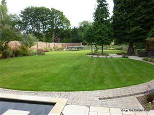 Basic rectangular garden transformed with simple curved lawn and path.