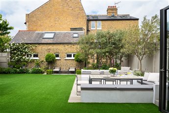 Clapham: Family garden designed with play space for 3 young children.
Combined lounging and dining, with integrated children’s play equipment and a BBQ and cooking area.
