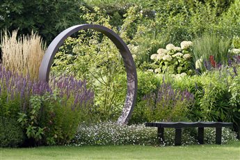 An old Victorian property breathes new life in Westerham, an orange brick and peg tile property has influenced our style. The garden has been transformed with features that include a copper sculpture, charred bespoke bench, copper water spouts