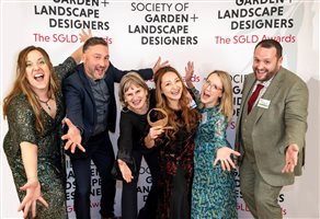 SGLD Awards 2026 Grand Award winner Charlotte Rowe Garden Design, Principal Designer Tomoko Kawauchi MSGLD with sponsor Ca'Pietra