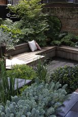 I have a designed some interesting quirky angles and junctions into this two-level small city garden. The material palette includes charred timber, using a Japanese technique to preserve the timber, called shou sugi ban. 