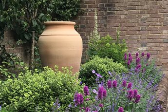 Terracotta urn rural garden design, Ditchling, East Sussex