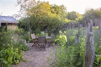 A wildlife friendly Eco house garden designed with resident bats in mind, local and reclaimed materials, bio-diverse, low carbon, this garden won the 'Design for the Environment' SGD Award 2022. Photo Credit: Abigail Rex