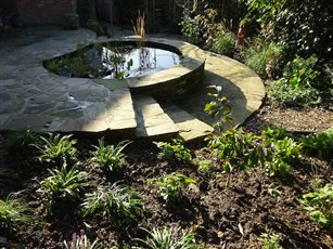Low Intervention Wildlife garden, Tunbridge Wells.
York stone on site has been recycled into a strong geometric layout. Woodland style planting through the majority of the space under a mature tree and shrub canopy supports a dense bird population.
