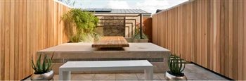 A garden over an underground carpark. A water feature wall  is surrounded by raised beds with a simple planting palette. Designed as an external room for dining and  sitting.
9mx 5m