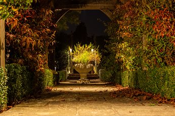 Garden lighting design and installation by Mark Packham, Garden and Landscape Lighting Designer at Garden Spark 
Country house large pergola and planted urn gently illuminated at night