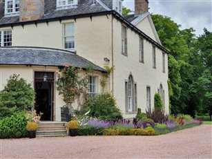 Country House Garden. The entrance to this house was improved by the introduction of new borders and colourful planting. 