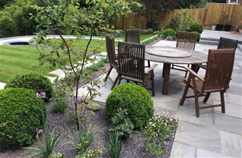 Creating usable space in a steeply sloping garden.