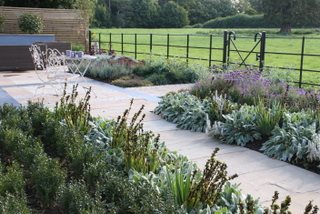 A 'no-lawn' garden with plenty of room for seating and dining. Beautiful open views onto the Yorkshire landscape from the garden.
