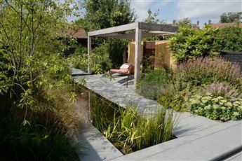 Set in the South Downs National Park, this garden has a large rill, garden office and outside kitchen.
35m x 8m