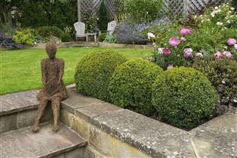 Sculpture and planting design.  Yorkshire Country Garden, Ilkley.