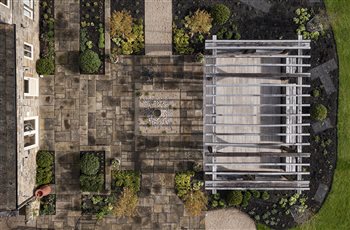 Farmhouse on Ilkley moor.  Contemporary country garden.  Large bespoke oak pergola, reclaimed yorkstone paved courtyard with waterfeature