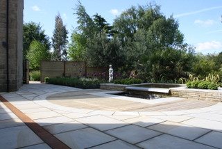 Large garden terrace area with water feature.