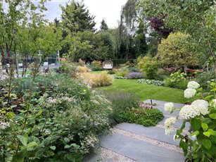 A family garden in Hertfordshire, featuring a swimming pool and outdoor kitchen.
Designed by James Scott and built by The Garden Company.  Winner of two prestigious BALI Awards - Design Excellence and Domestic Construction.  