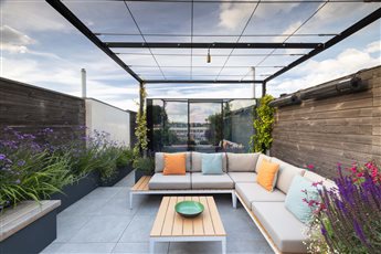 A Roof Garden in an inner city location. The climbers will soon cover the pergola to create shade whilst the sun loving planting in lightweight planters help cool the terrace and bring wildlife in at 5 stories up.