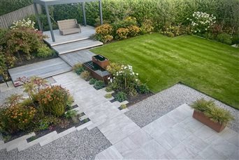 In this new build garden in Glasgow, we used deep borders, bringing planting away from the boundaries, and a generous lawn to create an open feel desired by the clients with private seating pockets nestled amongst planting. 