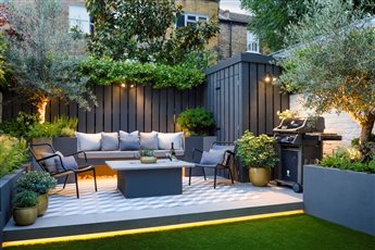 Clapham city Garden: Small but effective entertaining space with heating, remote control lighting, extensive planting and cohesive palette of materials and colours.