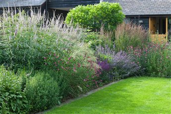 Modern Barn Conversion Garden

Split Level terraces in sandstone and redbrick, Lawn, formal trees and perennial planting. 