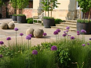 Alliums, stone balls and Bath cauldron planters