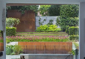 Garden Design in Hampstead using Corten steel as focal accents.