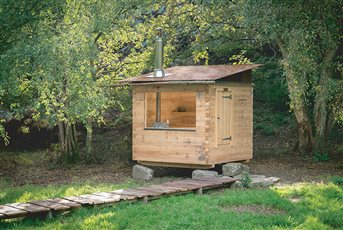 Sauna lodge sitting on boulders