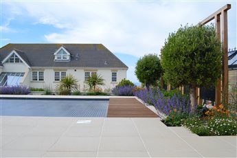 Brighton seafront garden design, porcelain pool terrace with long sea views.