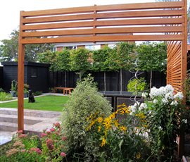 Cedar screens and colourful herbaceous borders.