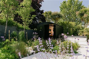 Wildhut luxury 8 person outdoor sauna with integrated outdoor shower and specialist ambient sauna lighting designed and installed for a client in Hove, UK in 2023.