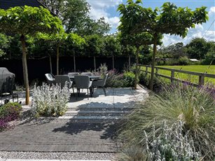 Drought Tolerant Cambridgeshire Garden

Large unit porcelain paving, Belgian bricks, grey and pastel informal planting.