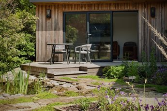 We changed the layout of this garden to create a journey through the space, repurposed all the existing hard landscaping materials & created a planting palette and pond for wildlife. Award-winning design for sustainability & biodiversity