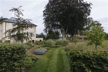 Flood resilient garden around new dwelling on the banks of a river 