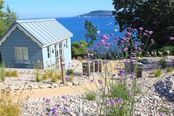 Bordered on one side by the coast and on another by a SSSI, this steeply sloping site needed a landscape design which stabilised the land, dealt with the drainage and provided substantial ecological benefits.