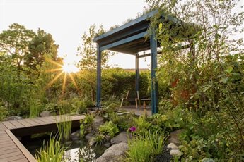 Platinum award-winning show garden that highlights the vital connection between water, plants, people, and nature. It focuses on innovative design techniques that slow down water flow, ensuring it is conserved and used effectively. 