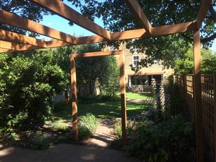 Custom made iroko pergola and arch in Ravenscourt Park