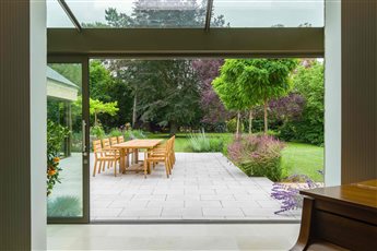 Edwardian House Cambridge

Limestone paving, Belgian bricks, formal trees and informal planting.