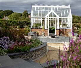 Glass house with paddlestone seating 