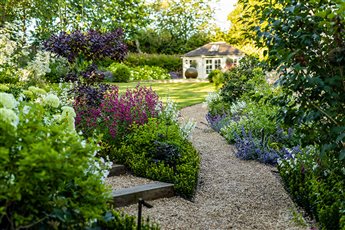 A flowing family garden in a village location.