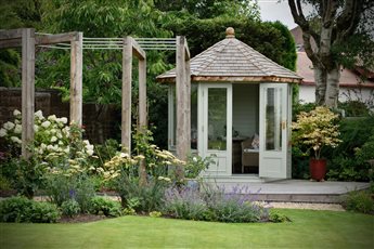 We created a country-style geometric designed garden in Paisley offering better access with generous steps and flow through the garden to the new summerhouse nestled within deep borders that combined existing and new planting for wildlife. 