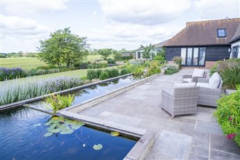 Garden Build by Cube 1994, bespoke tiered water feature with rill and fish pond area 