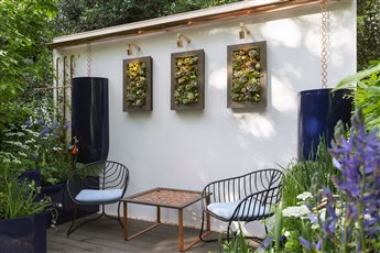 'The Water Saving Garden' designed and created for RHS Chelsea Flower Show 2024, to promote an important message about the need to save water. The garden illustrated ways to capture, store and re-use rainwater, to save precious drinking water.