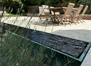 The Rill Amaya™ is a refined high end water feature, with a real bronze exterior in two different patinas. Bubbling fountains with an infinity edge removes debris for a polished surface. Supplied as a bespoke size product, installed on site.