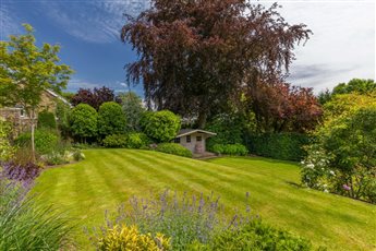 Large country home and garden. Planting design. 